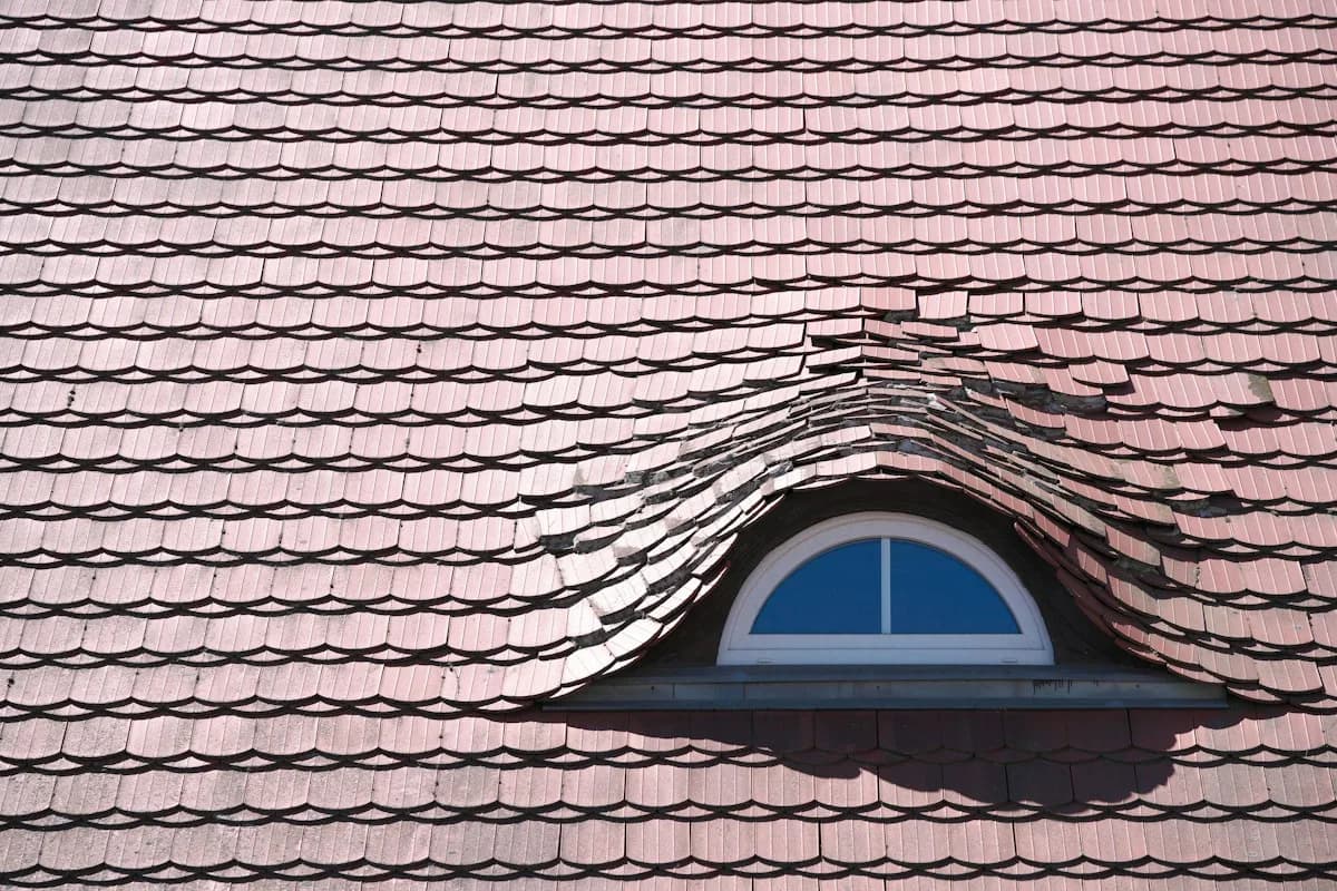 Dormer and adjoining roof planes showing several water-shedding connections