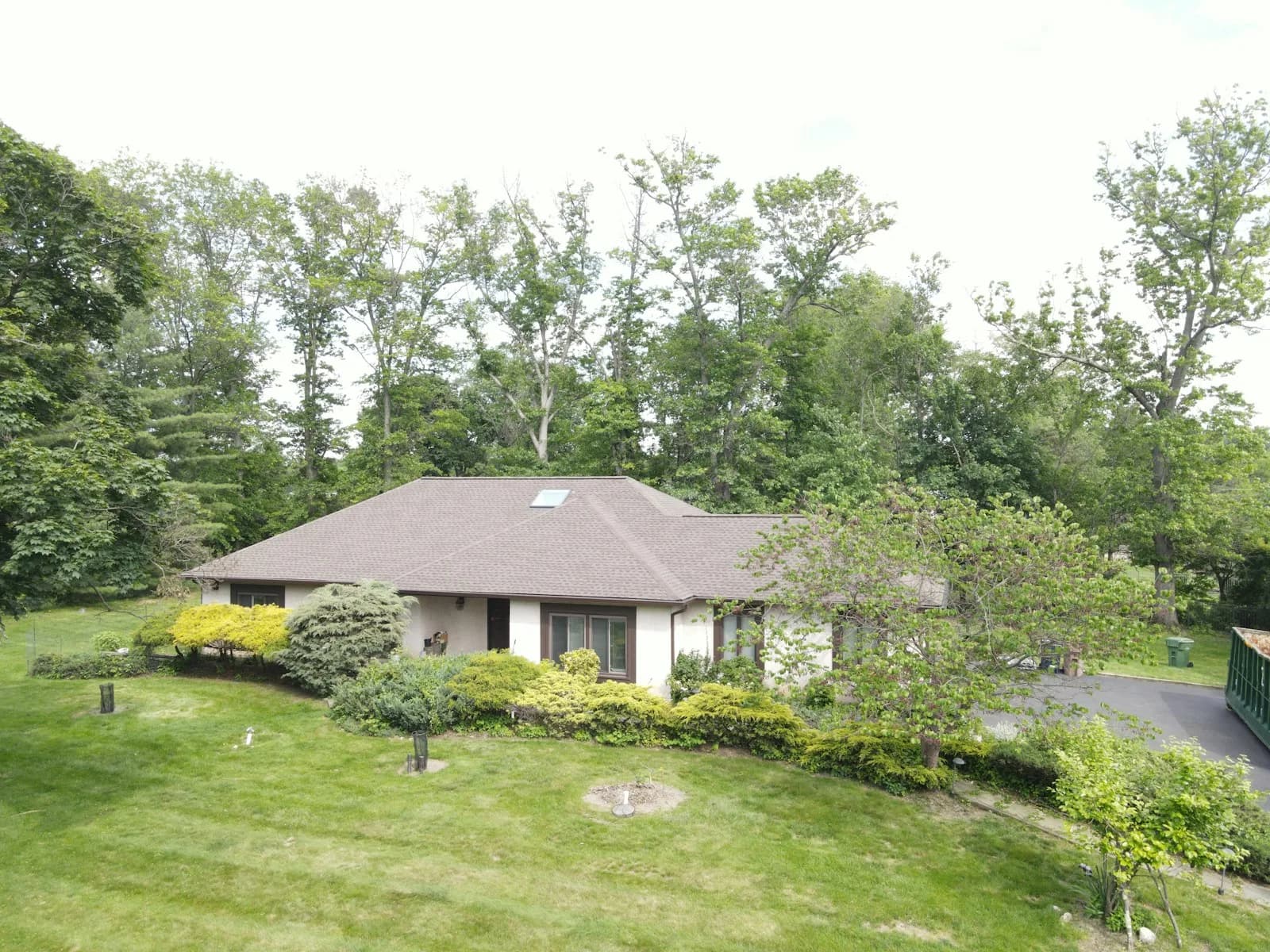 Trees close to a residential roof, illustrating branch exposure